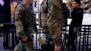 National guard start carrying firearms in DC as Trump says Chicago may be next – The Guardian